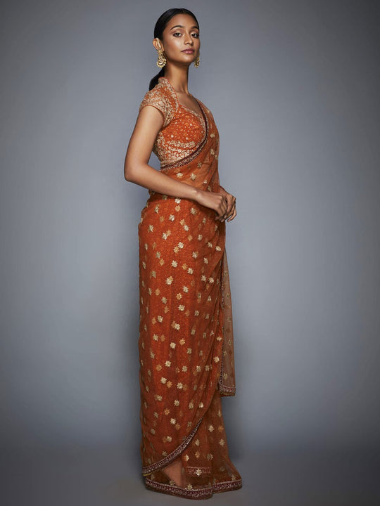 Raw Silk Wedding Golden Orange Designer Silk Saree at best price in  Ahmedabad